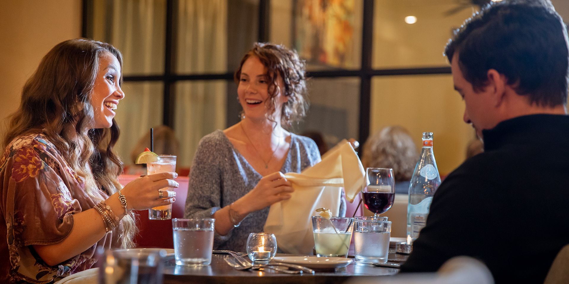 People enjoying dinner at Ember